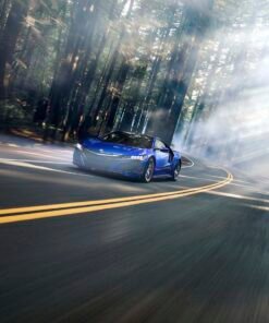 "Stunning Acura NSX NC1 driving through a forest road with sun rays breaking through the trees – a perfect blend of speed, design, and nature, available at Pictik."